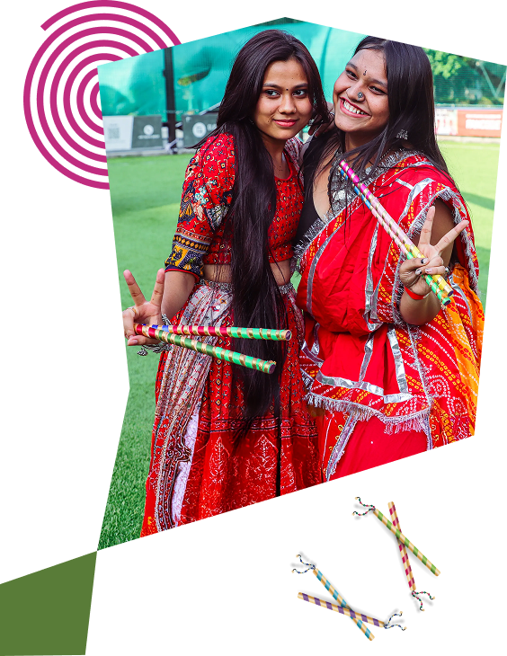 Students celebrating with dandiya sticks
